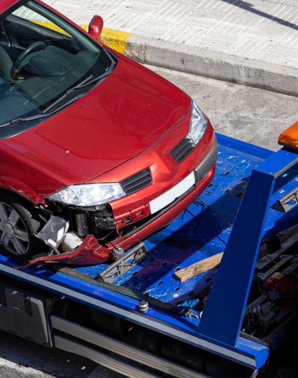 crashed-car-loaded-tow-truck-damage-vehicle-after-crash-accident-city-street